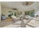Spacious covered patio with multiple seating areas and views of the pool at 7168 Ryedale Ct, Sarasota, FL 34241
