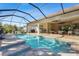 Expansive pool and screened patio with comfortable seating at 7168 Ryedale Ct, Sarasota, FL 34241