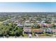 Neighborhood view showcasing various homes and landscaping at 9363 Steubenville Ave, Englewood, FL 34224