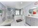 Spa-like bathroom featuring a large shower, soaking tub, and stylish fixtures at 9363 Steubenville Ave, Englewood, FL 34224