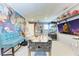 Entertainment room with foosball table and superhero wall art at 9363 Steubenville Ave, Englewood, FL 34224