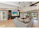 Spacious living room with vaulted ceilings, large sectional sofa, and a fireplace at 9363 Steubenville Ave, Englewood, FL 34224