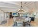 Open living area with high ceilings, a chandelier, and tile floors at 9363 Steubenville Ave, Englewood, FL 34224