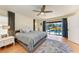 Main bedroom with king bed and sliding doors to pool at 9363 Steubenville Ave, Englewood, FL 34224