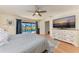 Main bedroom with king bed, dresser, and pool view at 9363 Steubenville Ave, Englewood, FL 34224