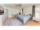 Main bedroom with king bed and sitting area at 9363 Steubenville Ave, Englewood, FL 34224
