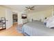 Main bedroom with king bed and view of living room at 9363 Steubenville Ave, Englewood, FL 34224