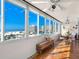 Relaxing balcony with ocean view, tiled floor, and outdoor seating at 1080 W Peppertree Ln # 506A, Sarasota, FL 34242