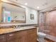 Bathroom with granite vanity and shower/tub combo at 1080 W Peppertree Ln # 506A, Sarasota, FL 34242