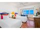Guest bedroom with ocean view and twin beds at 1080 W Peppertree Ln # 506A, Sarasota, FL 34242