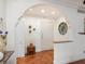 Inviting entryway with arched doorway and tile floor at 1080 W Peppertree Ln # 506A, Sarasota, FL 34242