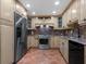 Well-equipped kitchen with granite counters at 1080 W Peppertree Ln # 506A, Sarasota, FL 34242