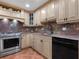 Kitchen with granite countertops and wood cabinets at 1080 W Peppertree Ln # 506A, Sarasota, FL 34242