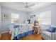 Bedroom with coastal decor and ceiling fan at 2369 Browning St, Sarasota, FL 34237