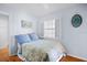 Bedroom with light blue walls and coastal decor at 2369 Browning St, Sarasota, FL 34237