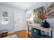 Bright entryway with hardwood floors and a console table at 2369 Browning St, Sarasota, FL 34237