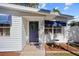 House entrance with a blue door and decorative accents at 2369 Browning St, Sarasota, FL 34237