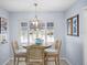 Charming kitchen breakfast nook with light blue walls at 2369 Browning St, Sarasota, FL 34237