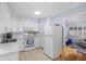 Modern kitchen featuring white cabinets and stainless steel appliances at 2369 Browning St, Sarasota, FL 34237