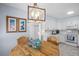 Kitchen with breakfast nook and white cabinetry at 2369 Browning St, Sarasota, FL 34237