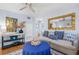 Living room featuring a light blue color scheme and a comfortable seating area at 2369 Browning St, Sarasota, FL 34237