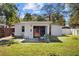 Private backyard patio with seating area and modern chairs at 2369 Browning St, Sarasota, FL 34237