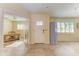 Bright and airy entryway with tile flooring and access to an office at 2629 Martin St, Sarasota, FL 34237