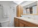 Clean bathroom with wood vanity and a large mirror at 305 30Th W Ave # A208, Bradenton, FL 34205
