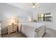 Bright bedroom with a ceiling fan and large window at 305 30Th W Ave # A208, Bradenton, FL 34205
