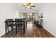 Bright dining area with wood floors and access to a private balcony at 305 30Th W Ave # A208, Bradenton, FL 34205