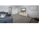 Relaxing living room featuring leather sofas and a media console at 305 30Th W Ave # A208, Bradenton, FL 34205