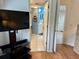 Bedroom with TV and view of bathroom at 4445 46Th W Ave, Bradenton, FL 34210