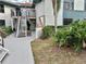 Condo building exterior with stairs and landscaping at 4445 46Th W Ave, Bradenton, FL 34210