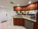 Well-equipped kitchen boasting granite countertops and wood cabinets at 4445 46Th W Ave, Bradenton, FL 34210