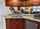 Kitchen with granite countertops and wooden cabinets at 4445 46Th W Ave, Bradenton, FL 34210