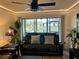 Living room with lake view and comfy seating at 4445 46Th W Ave, Bradenton, FL 34210