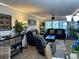 Spacious living room featuring reclining furniture and a large TV at 4445 46Th W Ave, Bradenton, FL 34210