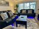 Comfortable living room with reclining sofas and a large TV at 4445 46Th W Ave, Bradenton, FL 34210