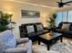 Living room with stylish furnishings and a large-screen TV at 4445 46Th W Ave, Bradenton, FL 34210