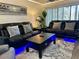 Modern living room with black leather couches and wood flooring at 4445 46Th W Ave, Bradenton, FL 34210