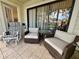 Patio with wicker chairs and table at 4445 46Th W Ave, Bradenton, FL 34210