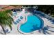 Community pool with surrounding lounge chairs and patio area at 4445 46Th W Ave, Bradenton, FL 34210
