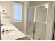 Spa-like bathroom with double sinks and a walk-in shower at 4627 Pippin Ln, Bradenton, FL 34211