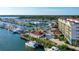An aerial view captures a marina with a mix of boat docks, condominiums, and the Intracoastal Waterway at 505 Tamiami N Trl # 201, Venice, FL 34285