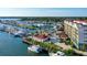 Gorgeous aerial view of the community marina with yachts, waterways, and clubhouse in this waterfront neighborhood at 505 Tamiami N Trl # 201, Venice, FL 34285