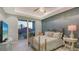 Bedroom with metal bed frame and balcony access at 505 Tamiami N Trl # 201, Venice, FL 34285