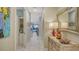Hallway with coastal art and decorative accents at 505 Tamiami N Trl # 201, Venice, FL 34285