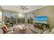 Inviting living room with large windows showcasing marina views and stylish coastal décor, and comfortable seating at 505 Tamiami N Trl # 201, Venice, FL 34285