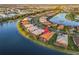 Aerial view of lakeside neighborhood and home featuring a red map pin at 5050 Surfside Cir, Lakewood Ranch, FL 34211