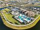 Stunning aerial view of community amenities, including a pool, tennis courts, and lush landscaping at 5050 Surfside Cir, Lakewood Ranch, FL 34211